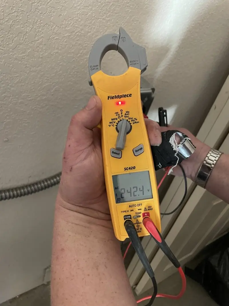 Voltage testing with clamp meter during Electrical Installation Services in Brookville